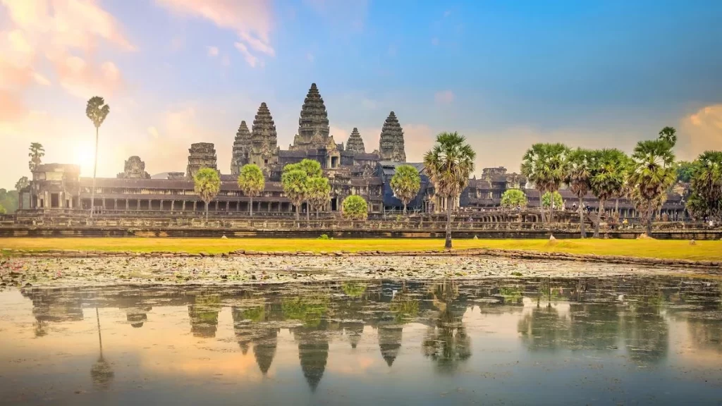 Aerial view of Angkor Wat's sprawling temple complex, showcasing its historical grandeur amidst the Cambodian jungle